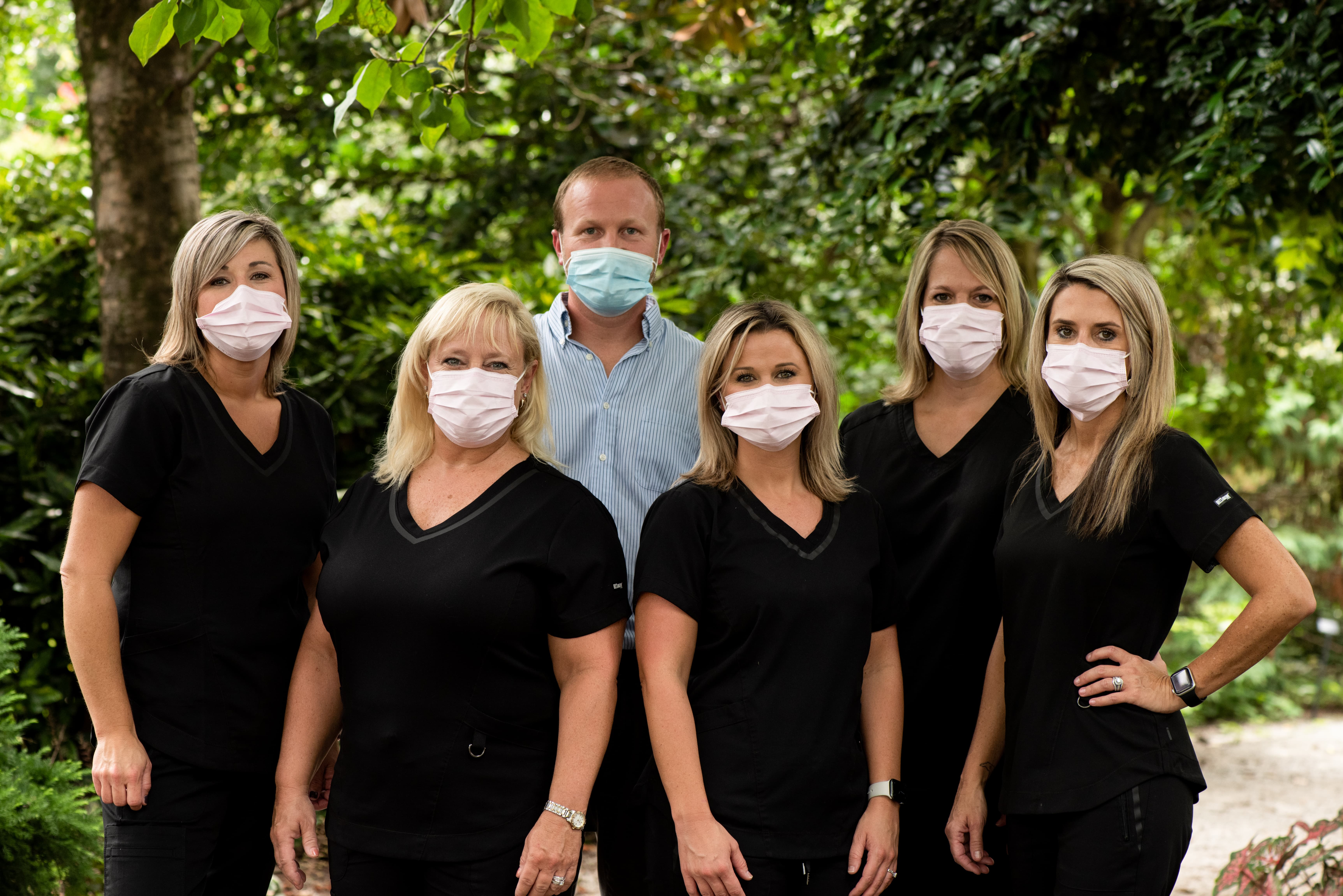 The family Dentistry team wearing masks